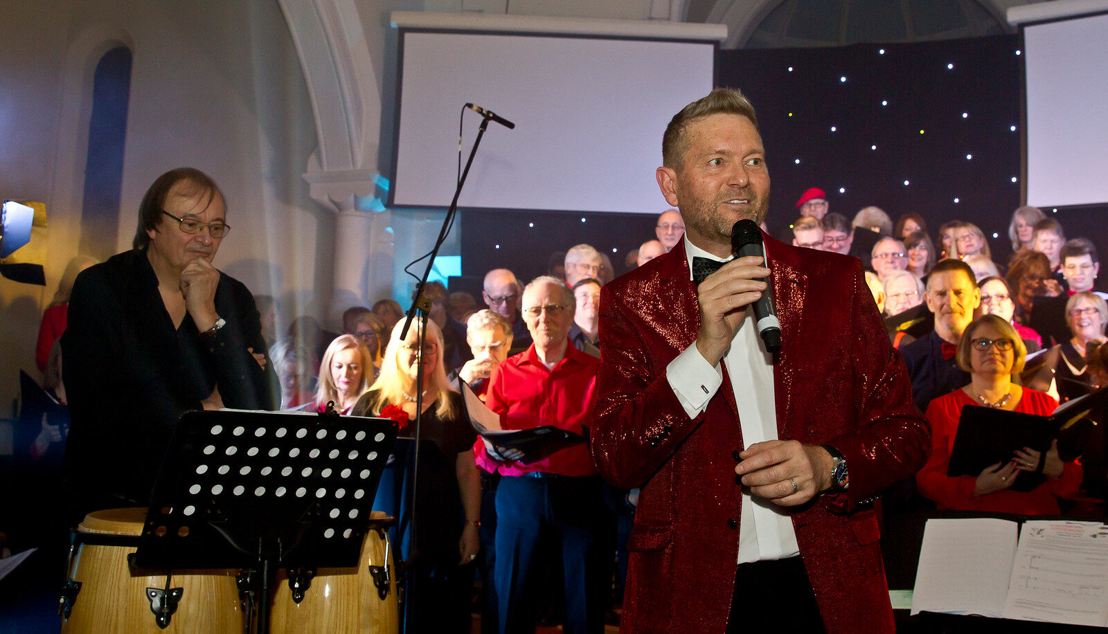 Cliff conducting in a Surrey music video